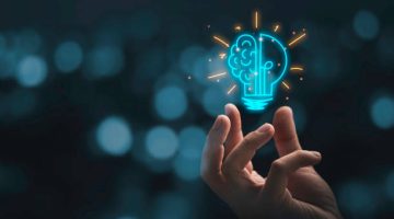 Hand holding drawing virtual lightbulb with brain on bokeh background for creative and smart thinking idea concep